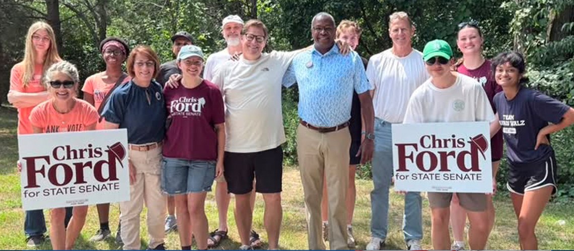 Chris Ford with supporters holding campaign signs