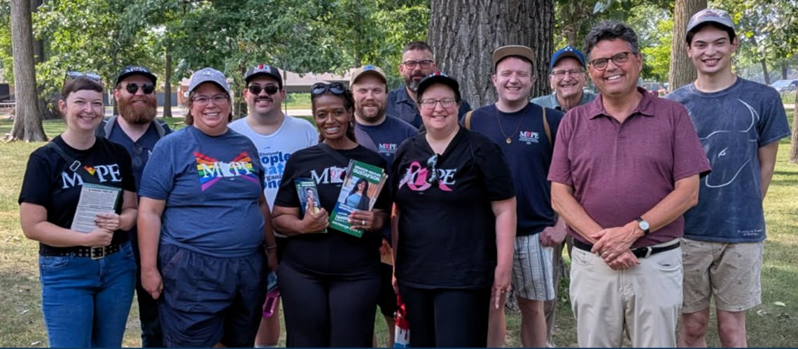 Jim DeMay with volunteers at a community event