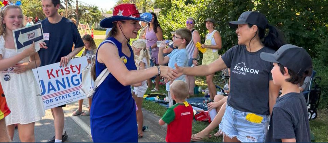 Kristy Janigo greeting supporters at a community parade